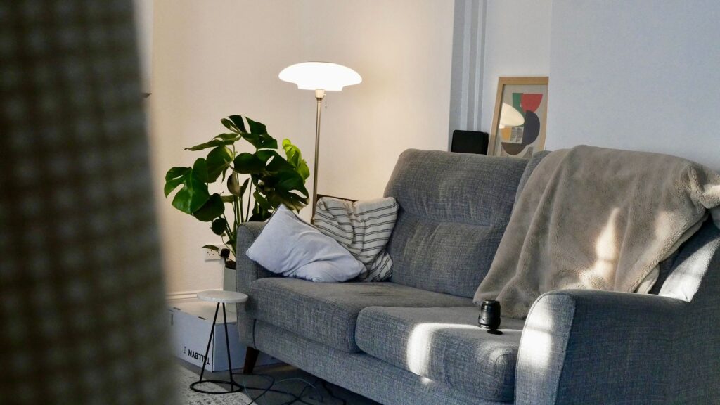 Cosy lounge-style sofa interior, similar to a private cannabis social club space