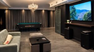 Lounge with big screen and chandelier at Meetpoint cannabis club, L'Alfàs del Pi