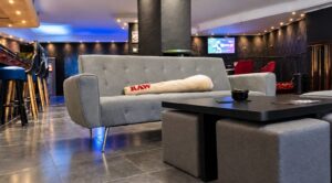 Lounge seating with blue ambient lighting at Meetpoint weed club near Benidorm