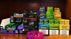 Rolling papers and smoking accessories on display at The High Lounge cannabis social club in Los Montesinos