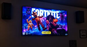 Gaming screen with Fortnite for members at The High Lounge cannabis social club in Los Montesinos