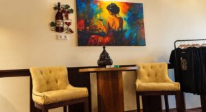 Armchairs, artwork and merchandise rack at The High Lounge cannabis social club in Los Montesinos